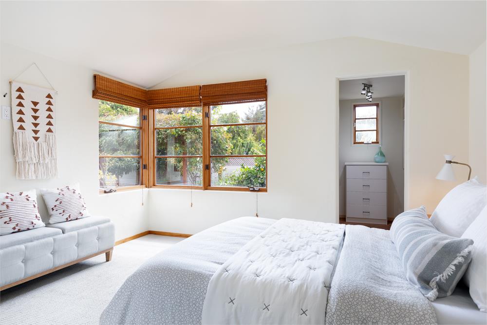 244 Aptos Beach Drive Aptos, CA 95003 - Photo 14 of 32 a bedroom with a large bed and a window