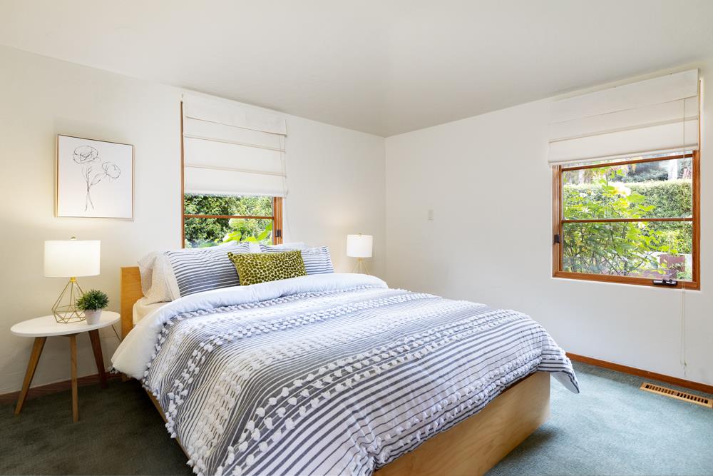 244 Aptos Beach Drive Aptos, CA 95003 - Photo 17 of 32 a bedroom with a bed and window
