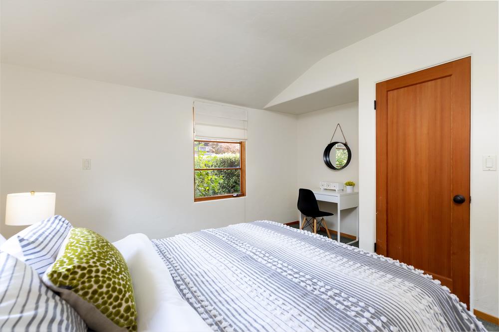 244 Aptos Beach Drive Aptos, CA 95003 - Photo 18 of 32 a bedroom with a bed and a window