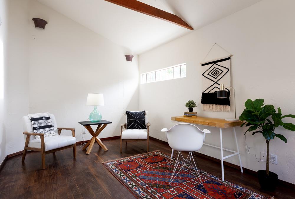 244 Aptos Beach Drive Aptos, CA 95003 - Photo 22 of 32 a living room with furniture and a potted plant