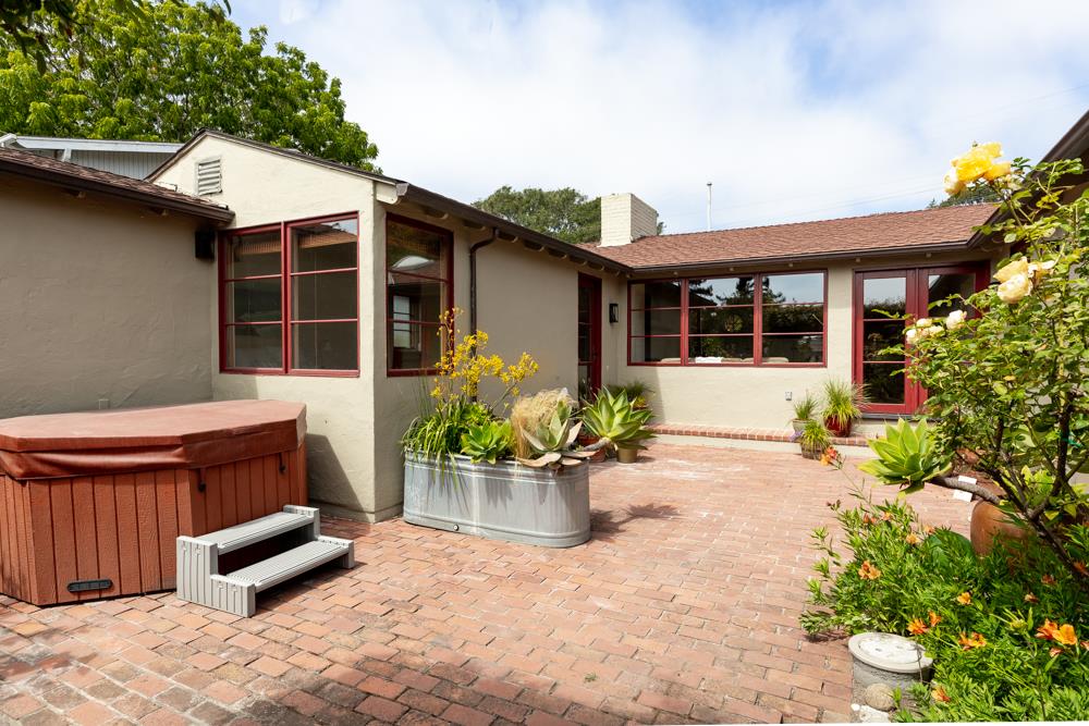 244 Aptos Beach Drive Aptos, CA 95003 - Photo 24 of 32 a front view of a house with a garden and plants