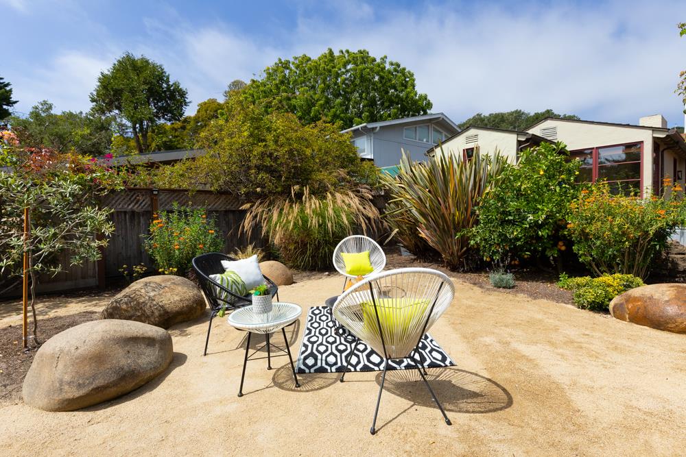 244 Aptos Beach Drive Aptos, CA 95003 - Photo 26 of 32 a view of a chairs and table in backyard