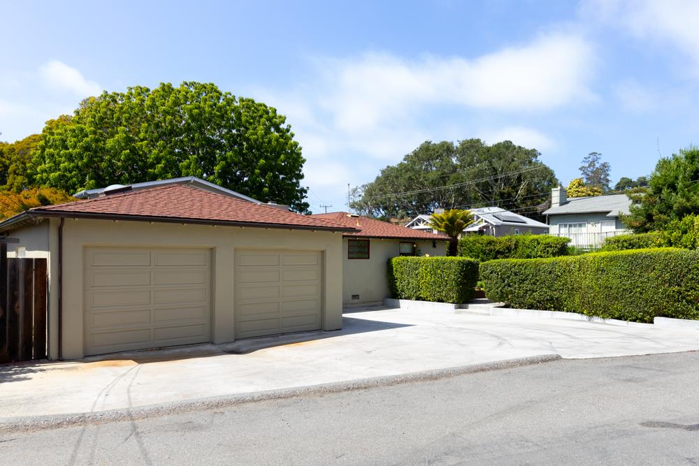 244 Aptos Beach Drive Aptos, CA 95003 - Photo 31 of 32 a front view of a house with a yard and garage