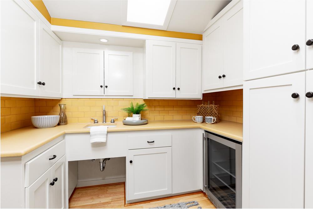 244 Aptos Beach Drive Aptos, CA 95003 - Photo 10 of 32 a kitchen with stainless steel appliances granite countertop a sink and dishwasher with white cabinets