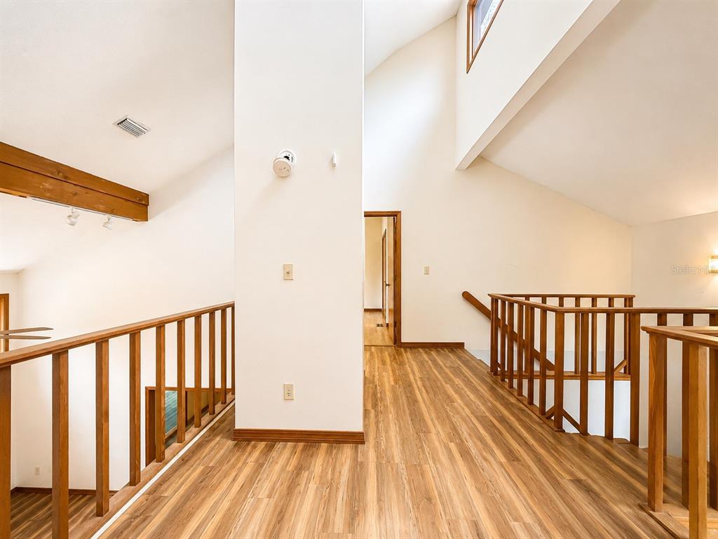 7119 Immokalee Road Keystone Heights, FL 32656 - Photo 22 of 50 a view of hallway with wooden floor