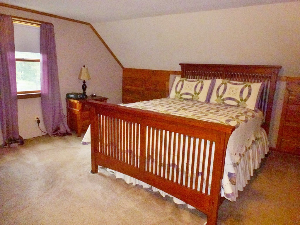 34 Exeter Street West Springfield, MA 01089 - Photo 14 of 25 a bedroom with a bed and window