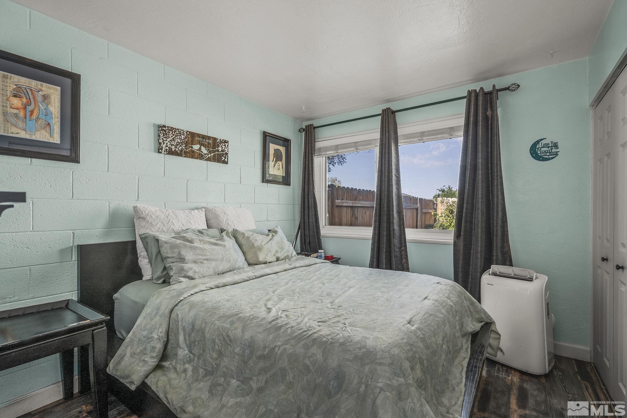 13693 Mt Baldy Street Reno, NV 89506 - Photo 12 of 18 a bedroom with a bed and a mirror