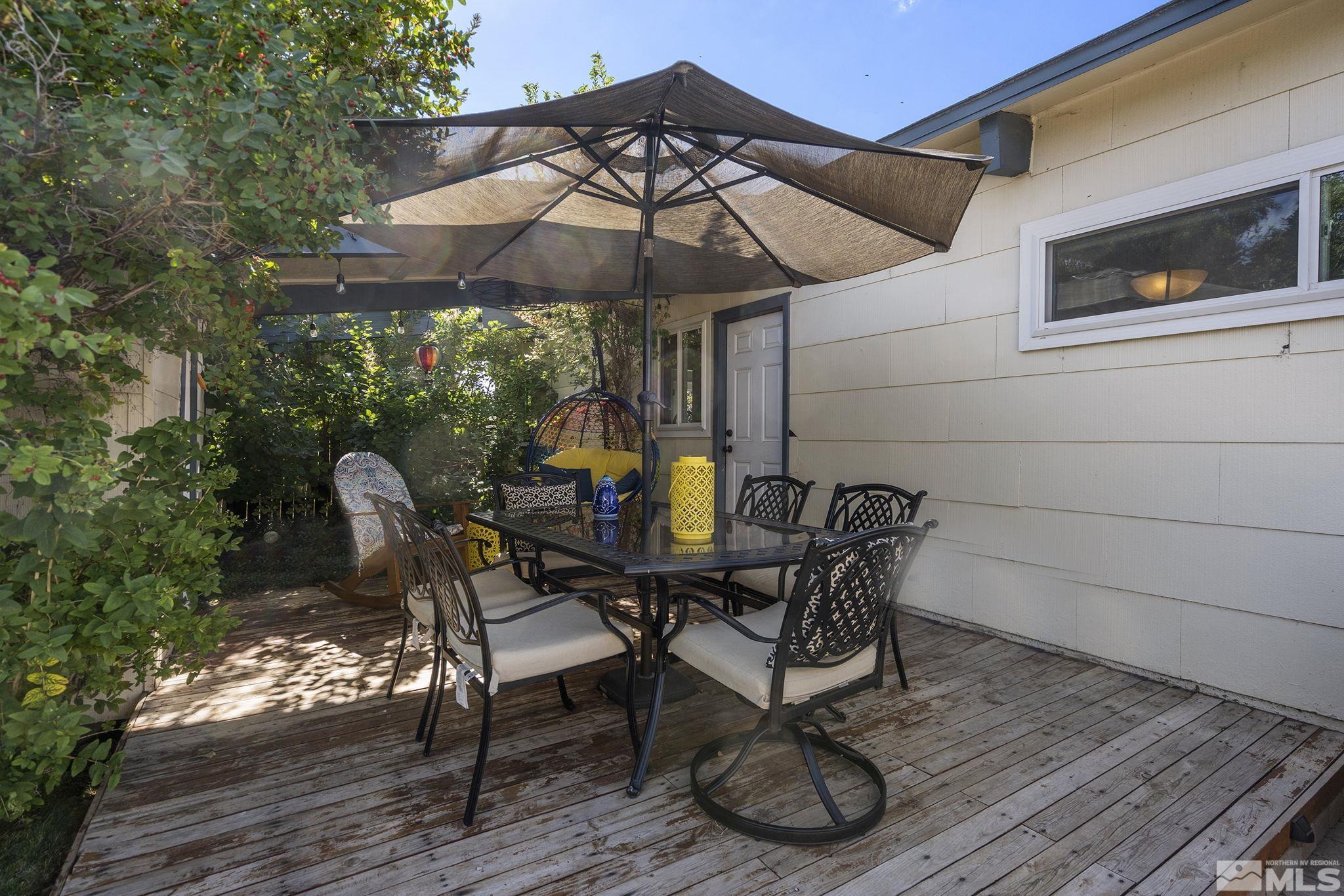 13693 Mt Baldy Street Reno, NV 89506 - Photo 14 of 18 a view of a table and chairs under an umbrella