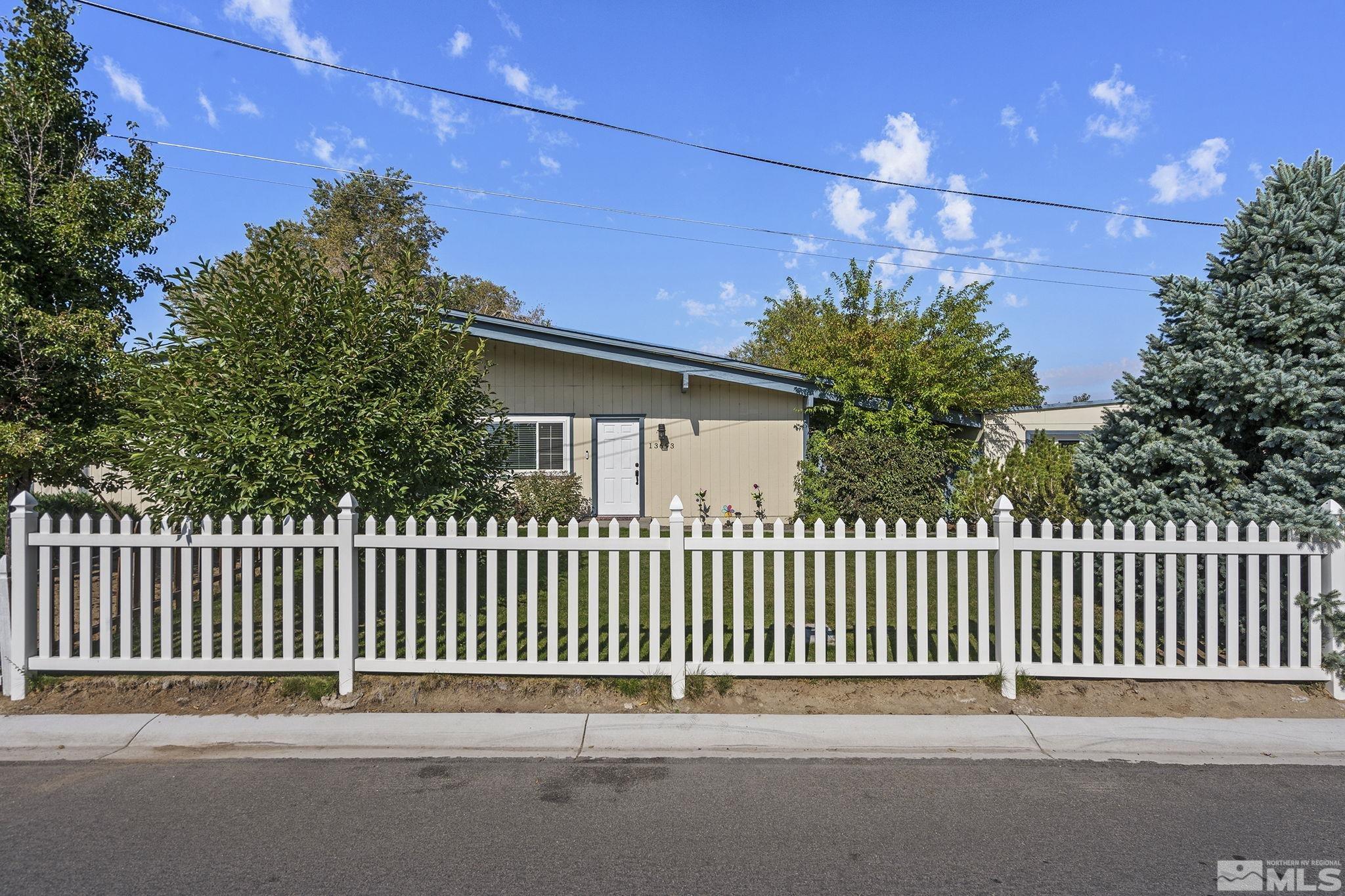 13693 Mt Baldy Street Reno, NV 89506 - Photo 2 of 18 a backyard of a house with plants and tree