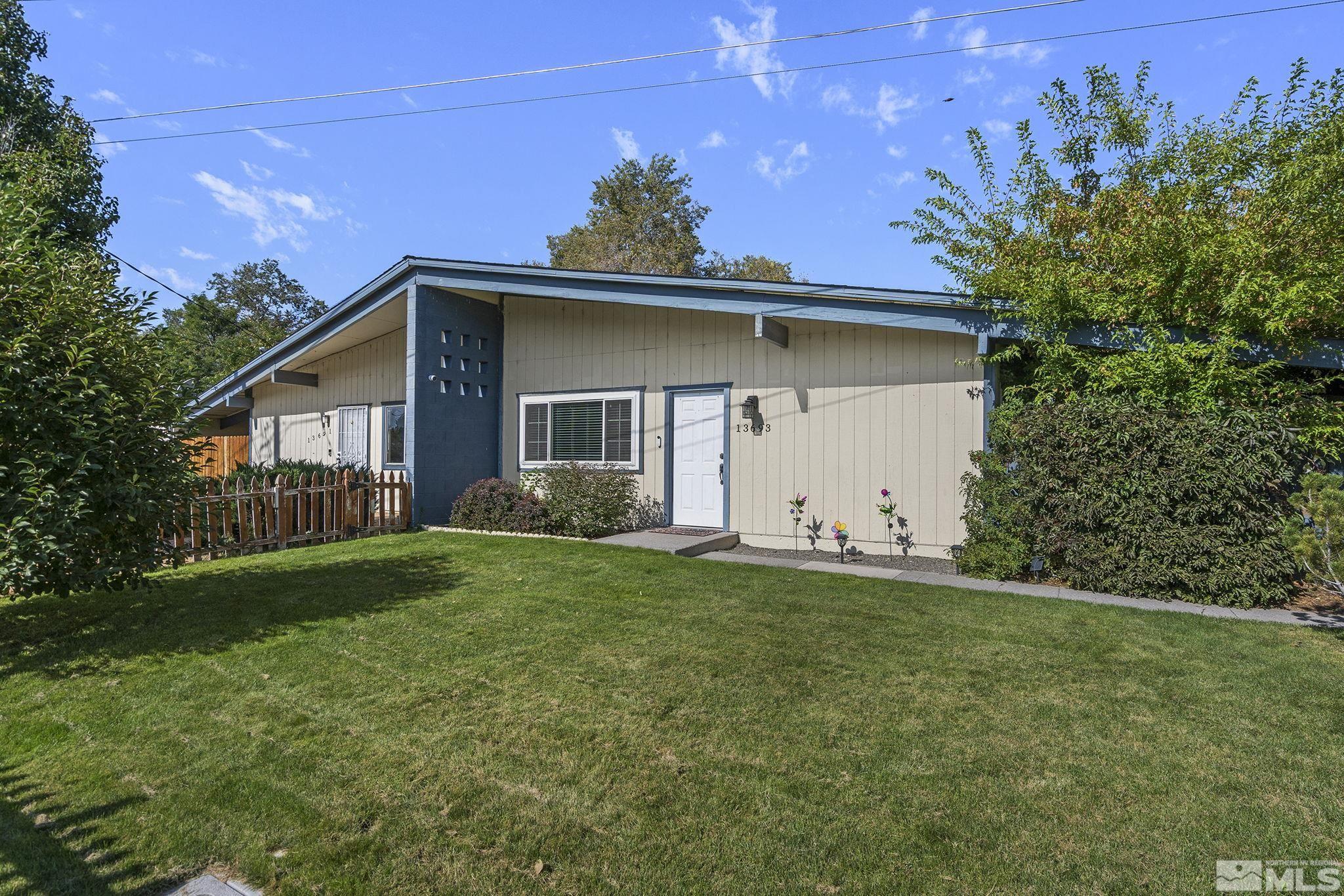 13693 Mt Baldy Street Reno, NV 89506 - Photo 3 of 18 a view of a house with a yard