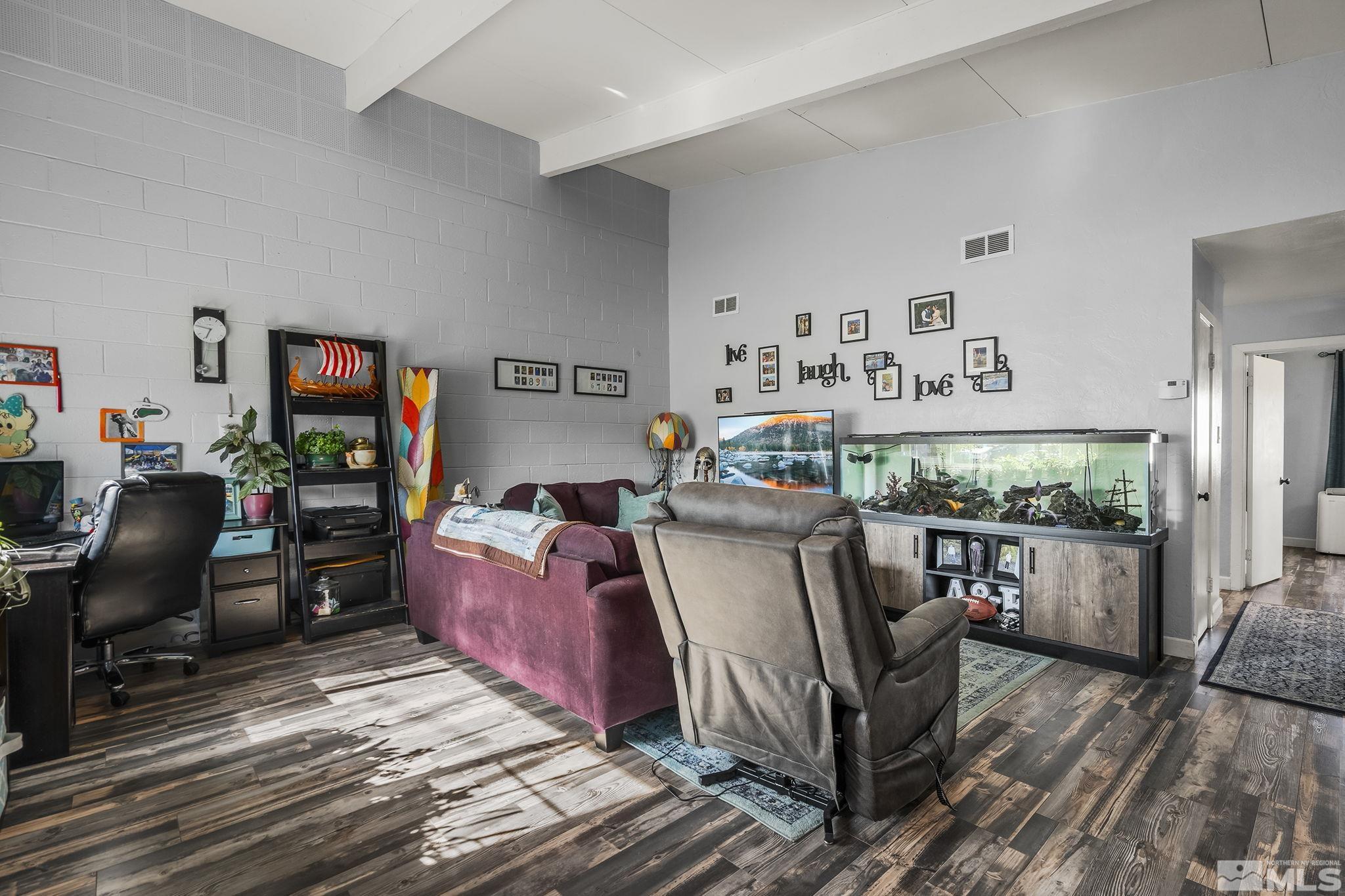 13693 Mt Baldy Street Reno, NV 89506 - Photo 4 of 18 a living room with furniture and a flat screen tv