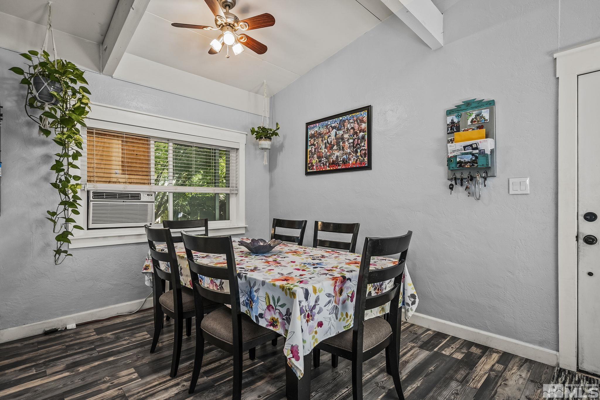 13693 Mt Baldy Street Reno, NV 89506 - Photo 10 of 18 a view of a dining room with furniture window and wooden floor