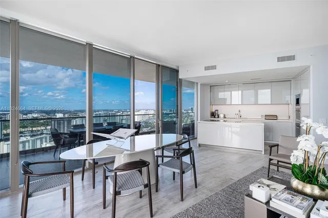 a view of a dining room with furniture window and outside view