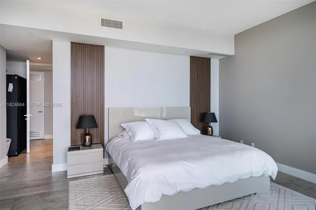 a bedroom with a bed and a walk in closet