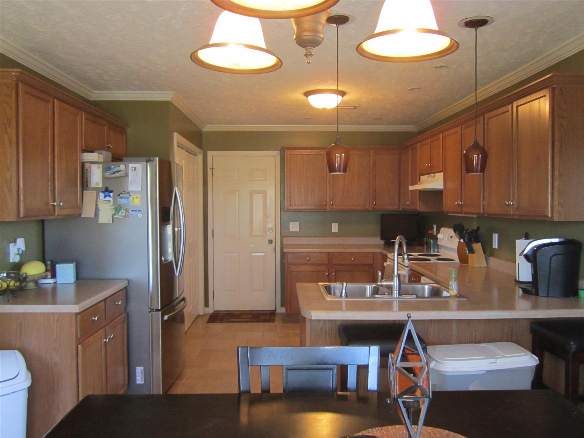 691 Crescent Road Murfreesboro, TN 37128 - Photo 4 of 15 a kitchen with stainless steel appliances granite countertop a sink and cabinets