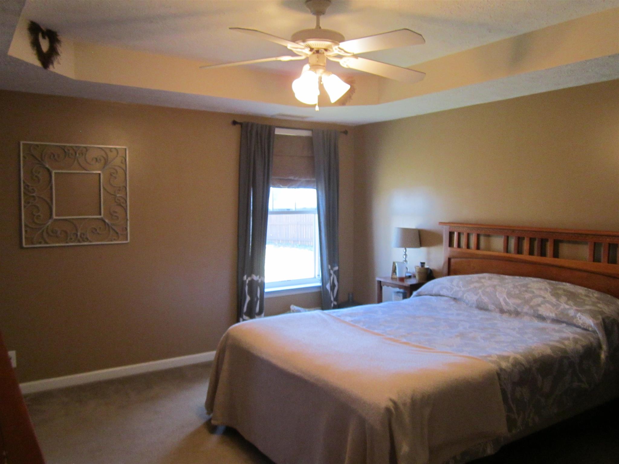 691 Crescent Road Murfreesboro, TN 37128 - Photo 8 of 15 a bedroom with a bed and a chandelier