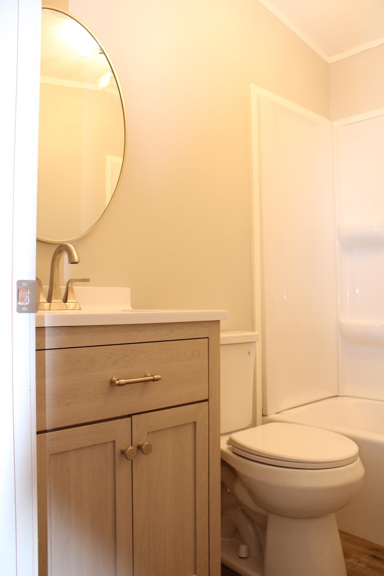 1535 Sand Ford Road Henning, TN 38041 - Photo 19 of 40 a bathroom with a sink a toilet and a mirror