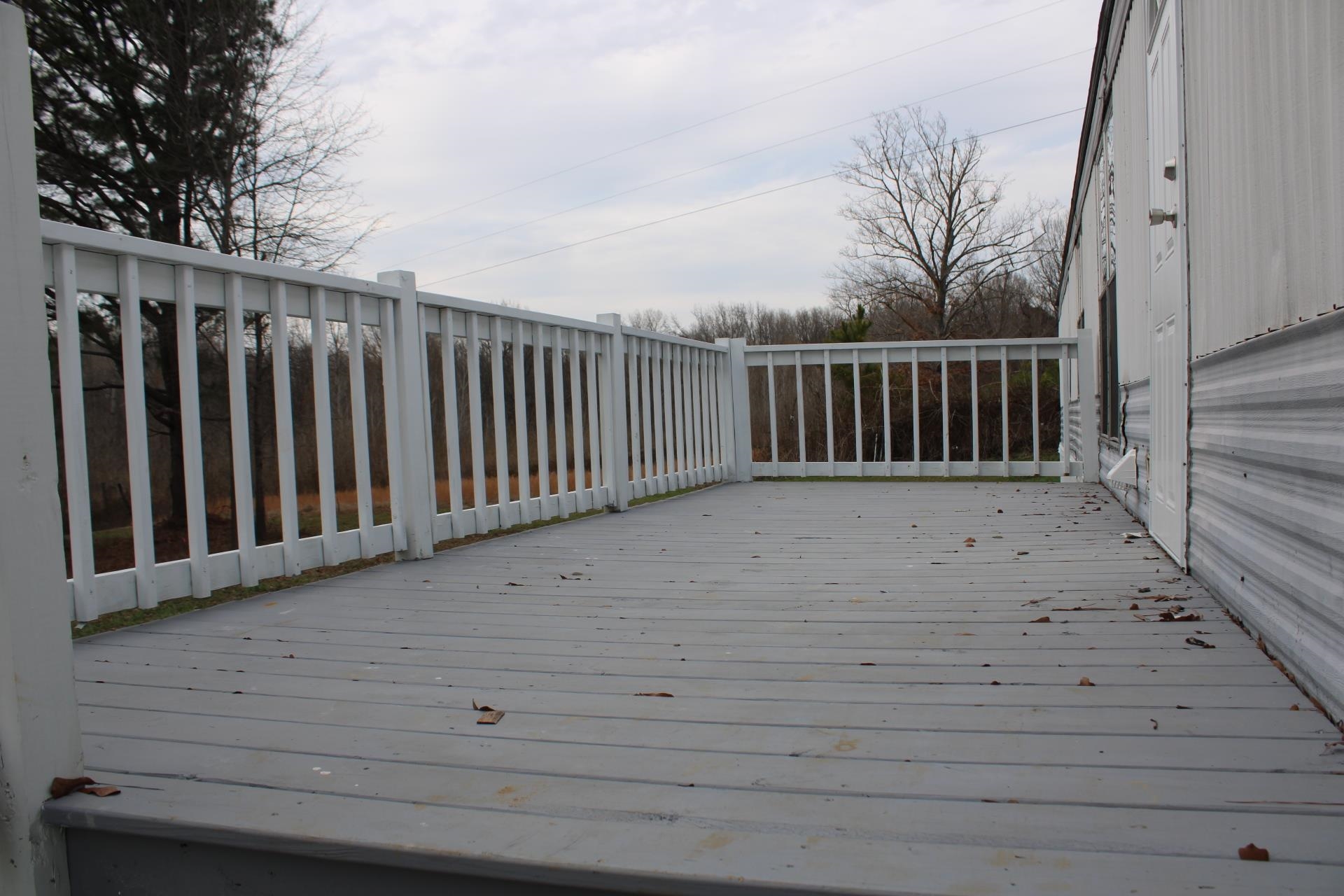 1535 Sand Ford Road Henning, TN 38041 - Photo 25 of 40 a view of balcony with wooden floor