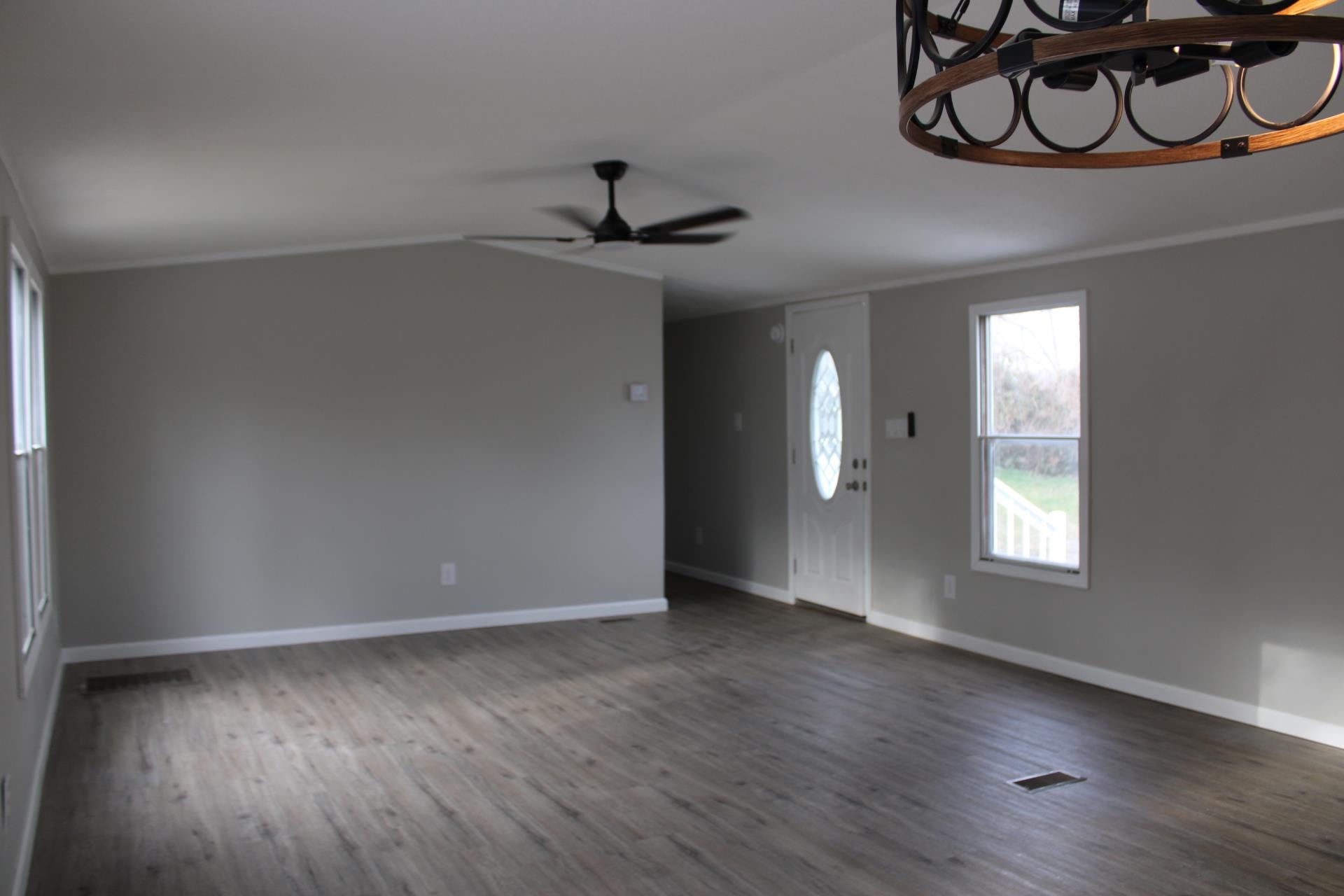 1535 Sand Ford Road Henning, TN 38041 - Photo 27 of 40 a view of an empty room and wooden floor