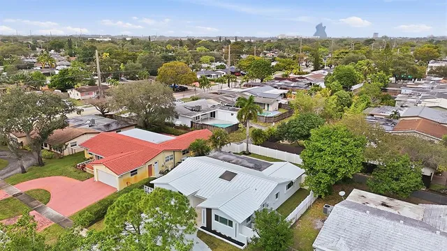 an aerial view of residential houses with outdoor space