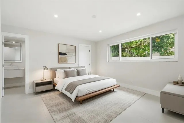a view of a workspace with furniture and a bookshelf
