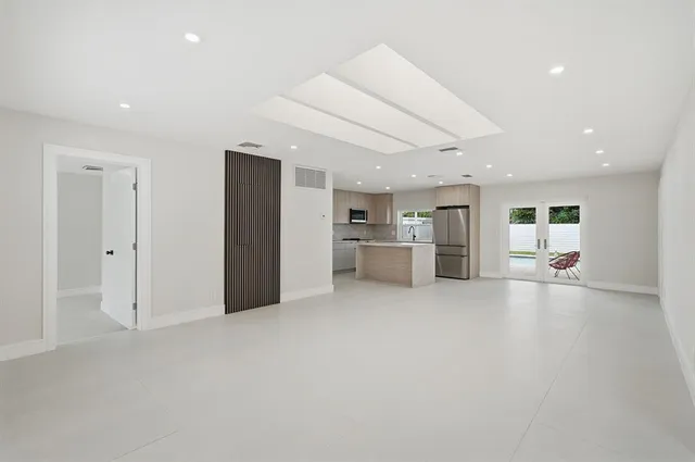 a kitchen with a sink and appliances