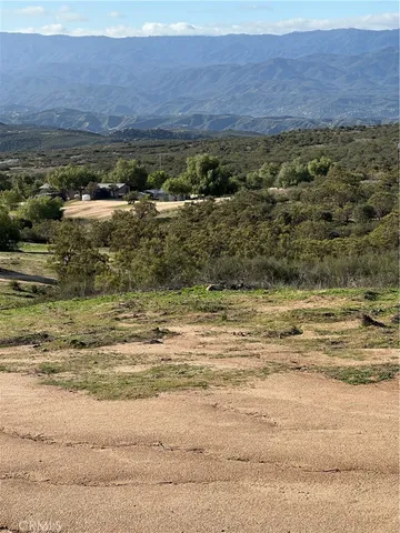 a view of ocean with a mountain