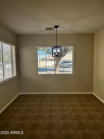 a kitchen with granite countertop a stove top oven a sink and a refrigerator