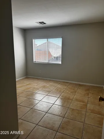 an empty room with a bathroom