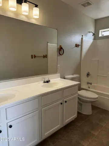 a bathroom with a sink a toilet and bathtub