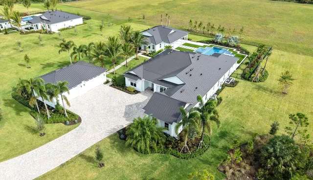 an aerial view of a house with a garden