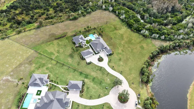 an aerial view of a house with outdoor space