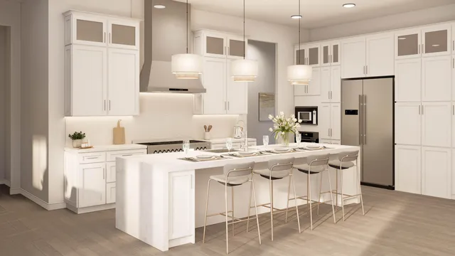 a kitchen with stainless steel appliances granite countertop a white cabinets and a refrigerator