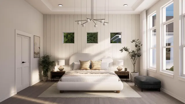 a bedroom with a large bed and a couch