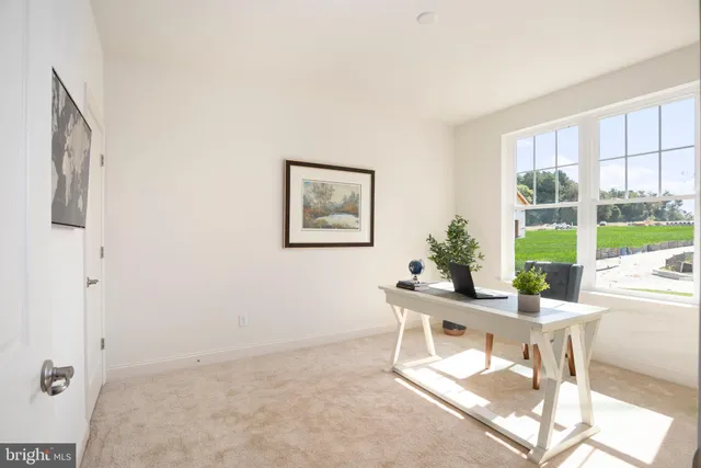 a workspace with furniture and a window
