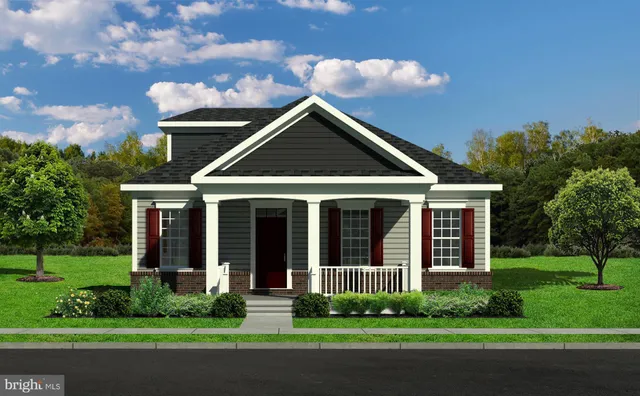 a view of a brick house with a yard