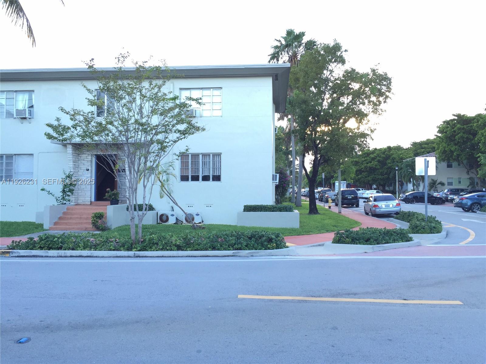 8340 Crespi Boulevard, Unit 19 Miami Beach, FL 33141 - Photo 11 of 35 a front view of a house with garden
