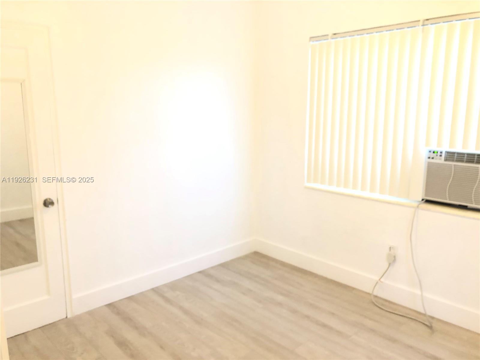 8340 Crespi Boulevard, Unit 19 Miami Beach, FL 33141 - Photo 17 of 35 a view of a room with a window