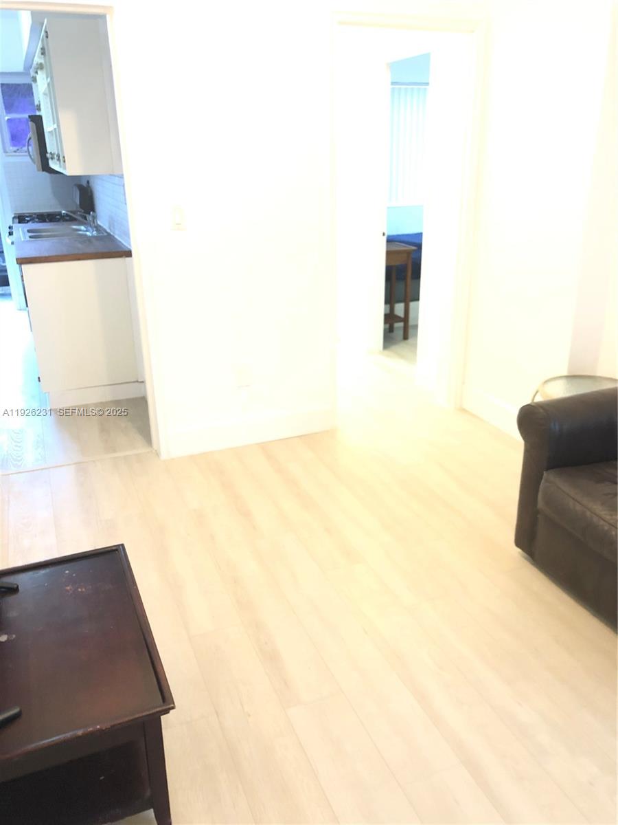 8340 Crespi Boulevard, Unit 19 Miami Beach, FL 33141 - Photo 25 of 35 a picture of a couch in a room