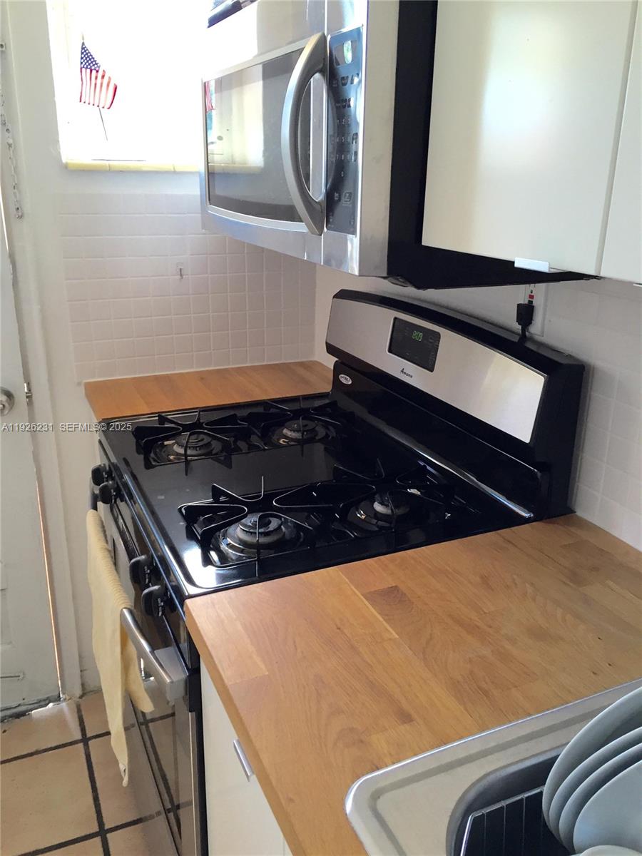 8340 Crespi Boulevard, Unit 19 Miami Beach, FL 33141 - Photo 31 of 35 a close view of kitchen appliances
