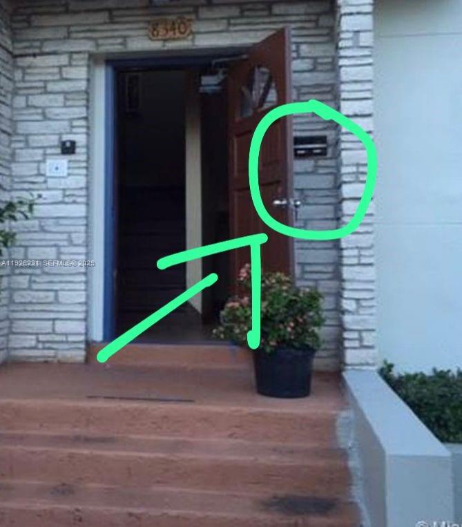 8340 Crespi Boulevard, Unit 19 Miami Beach, FL 33141 - Photo 35 of 35 a front view of a house with a garden