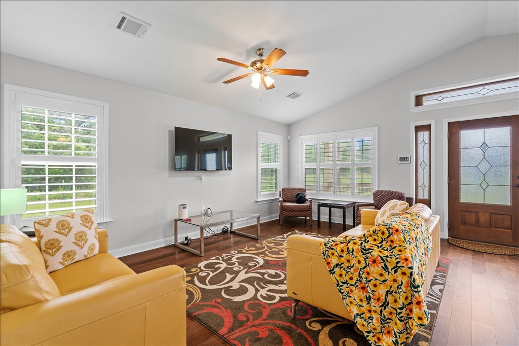 608 Whistleville Road Flatonia, TX 78941 - Photo 7 of 26 That wood front door with the decorative glass panels lets in some great natural light and plantation shutters elevate the space.