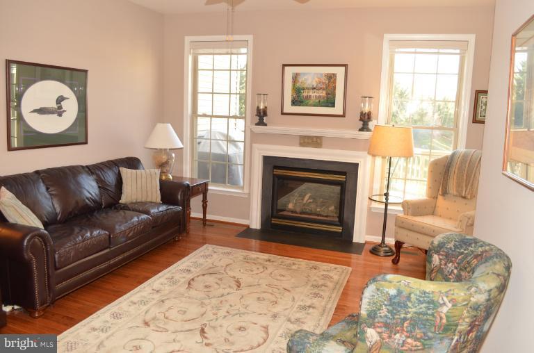 2407 Rippling Brook Road Frederick, MD 21701 - Photo 3 of 30 a living room with furniture and a fireplace