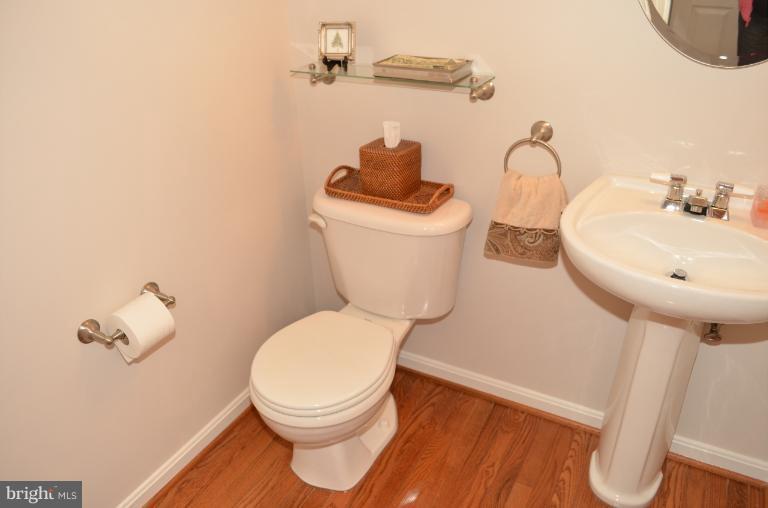 2407 Rippling Brook Road Frederick, MD 21701 - Photo 22 of 30 a bathroom with a toilet sink and mirror