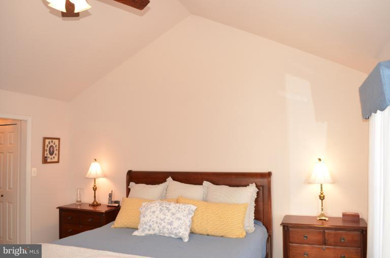 2407 Rippling Brook Road Frederick, MD 21701 - Photo 4 of 30 a bedroom with a bed and a lamp