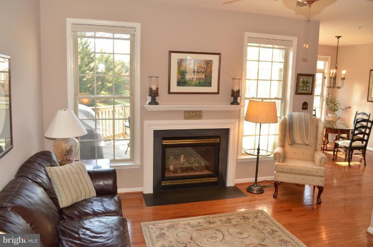 2407 Rippling Brook Road Frederick, MD 21701 - Photo 7 of 30 a living room with furniture and a fireplace