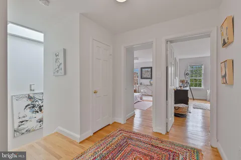 a living room with furniture rug and window