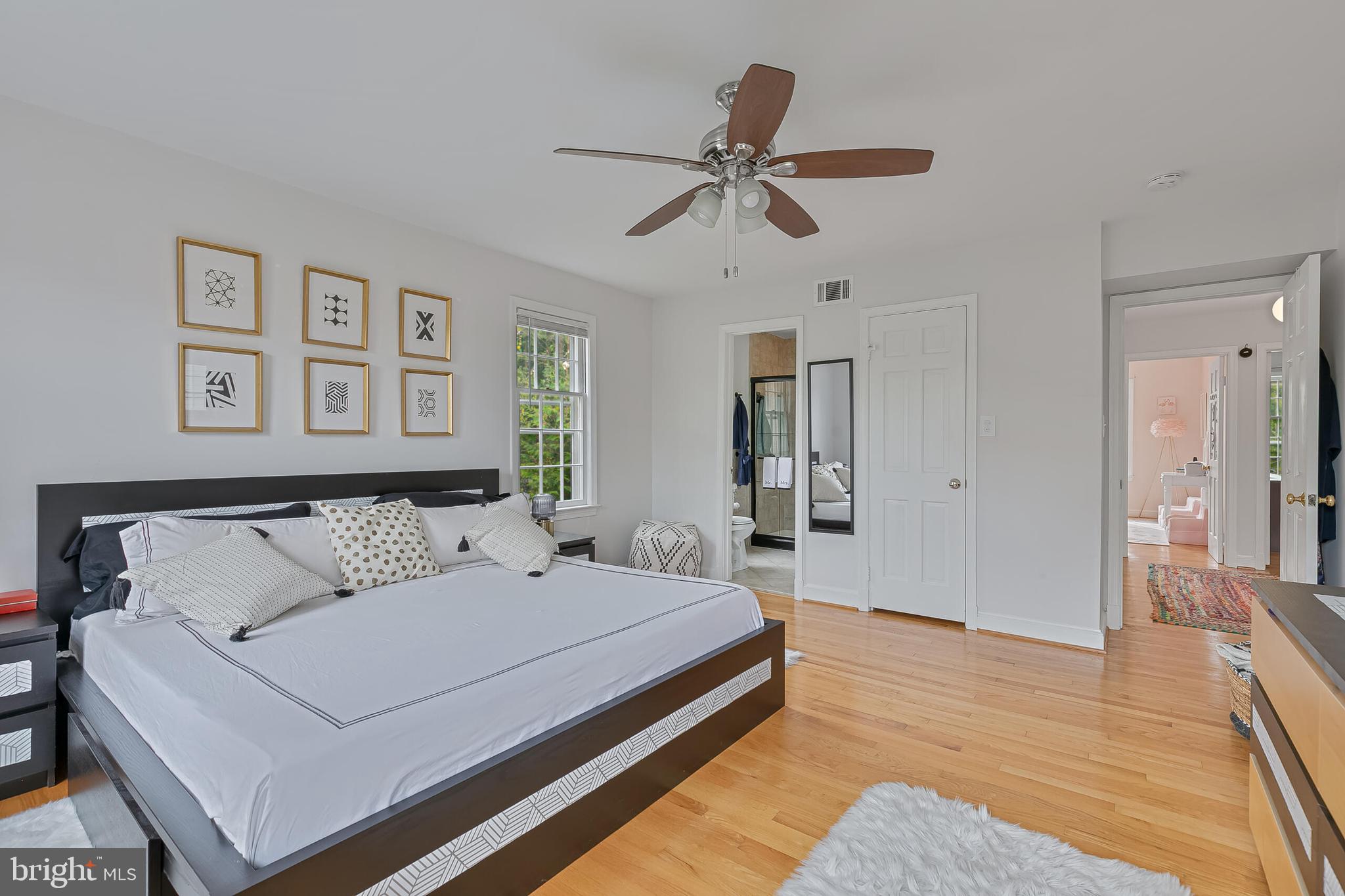 1340 North Lynnbrook Drive Arlington, VA 22201 - Photo 23 of 57 a bedroom with a large bed and a chandelier
