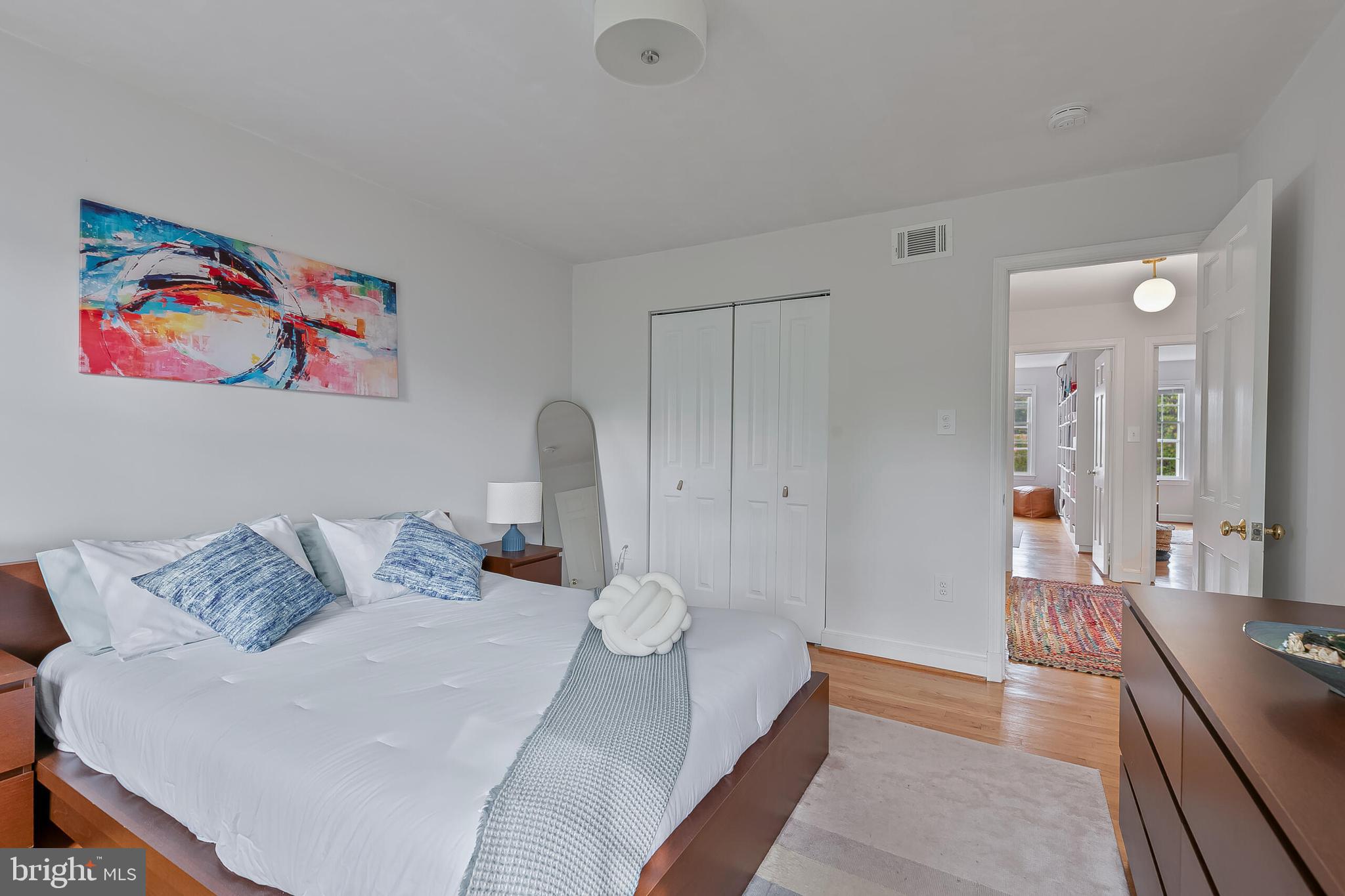 1340 North Lynnbrook Drive Arlington, VA 22201 - Photo 30 of 57 a bed room with a bed and a painting on the wall