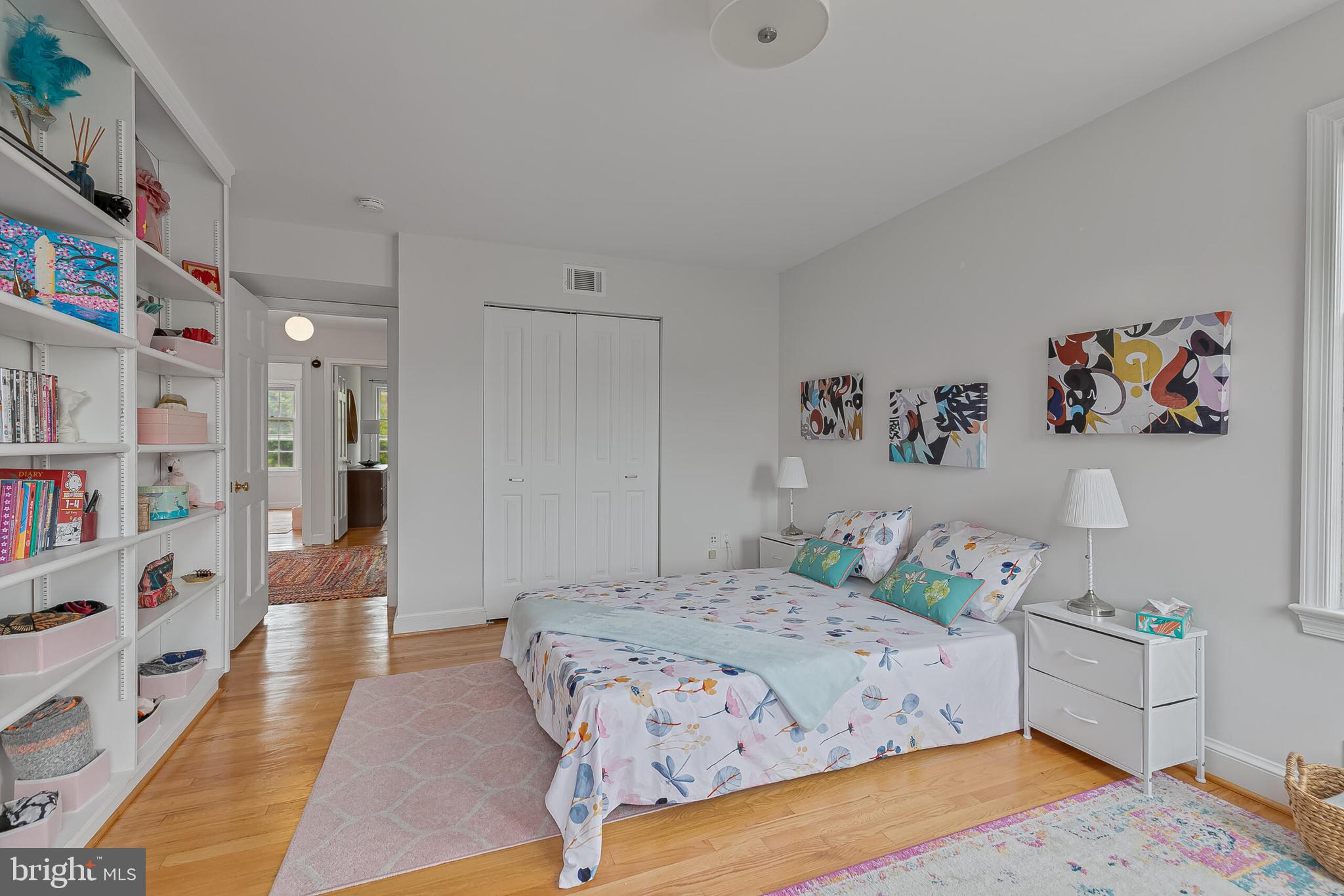 1340 North Lynnbrook Drive Arlington, VA 22201 - Photo 32 of 57 a bedroom with a bed and a book shelf
